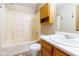 Bright bathroom featuring a vanity sink, mirror, and a shower-tub combination with updated fixtures at 18021 Sanibel Cir, Noblesville, IN 46062