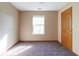 Well-lit bedroom with a window and neutral carpeting, offering a cozy and comfortable space at 18021 Sanibel Cir, Noblesville, IN 46062