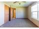 Neutral bedroom with plush carpet, a large window, and ample closet space at 18021 Sanibel Cir, Noblesville, IN 46062
