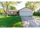 Charming single-story home with brick and vinyl siding and attached two-car garage at 18021 Sanibel Cir, Noblesville, IN 46062