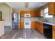 Well-lit kitchen featuring stainless steel appliances and wooden cabinets at 18021 Sanibel Cir, Noblesville, IN 46062