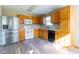 Kitchen featuring stainless steel appliances and wooden cabinets at 18021 Sanibel Cir, Noblesville, IN 46062