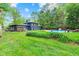 Spacious backyard featuring well-manicured lawn and an inviting in-ground pool for outdoor enjoyment at 1829 Kessler Blvd W Dr, Indianapolis, IN 46228