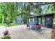 Charming home featuring a stone patio with outdoor seating and a grill for entertaining guests at 1829 Kessler Blvd W Dr, Indianapolis, IN 46228