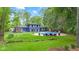 Lush backyard featuring a sparkling pool, perfect for outdoor entertainment and relaxation at 1829 Kessler Blvd W Dr, Indianapolis, IN 46228