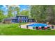 Beautiful backyard pool area with lounge seating and lush landscaping for relaxing and entertaining at 1829 Kessler Blvd W Dr, Indianapolis, IN 46228
