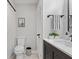 This is a view of the main bathroom including a toilet and tiled floors at 1829 Kessler Blvd W Dr, Indianapolis, IN 46228
