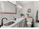 Bright bathroom featuring a sleek vanity with quartz countertops and chrome faucet at 1829 Kessler Blvd W Dr, Indianapolis, IN 46228