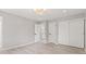 This bedroom has light hard wood floors, light grey walls, and a modern light fixture at 1829 Kessler Blvd W Dr, Indianapolis, IN 46228