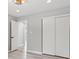Bedroom featuring closet and views of backyard greenery, showcasing natural light at 1829 Kessler Blvd W Dr, Indianapolis, IN 46228
