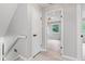Upstairs hallway with freshly painted walls and new door hardware to match at 1829 Kessler Blvd W Dr, Indianapolis, IN 46228