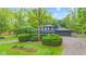 Charming two-story home featuring well-maintained landscaping and a welcoming driveway at 1829 Kessler Blvd W Dr, Indianapolis, IN 46228