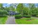 Beautifully landscaped home with a classic design and mature trees, creating a serene and inviting atmosphere at 1829 Kessler Blvd W Dr, Indianapolis, IN 46228
