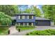 Lovely home exterior featuring a well-manicured lawn, lush greenery, and charming curb appeal at 1829 Kessler Blvd W Dr, Indianapolis, IN 46228