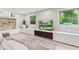Bright living room featuring a modern entertainment center and lots of natural light at 1829 Kessler Blvd W Dr, Indianapolis, IN 46228