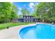 Beautiful home with a large pool and backyard, perfect for outdoor activities and entertaining guests at 1829 Kessler Blvd W Dr, Indianapolis, IN 46228