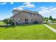Brick home with patio, lush lawn, and walking path at 186 W 600 N, Alexandria, IN 46001