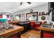 Spacious bar area featuring rustic wood counters, red accents, and ample space for entertaining guests at 186 W 600 N, Alexandria, IN 46001