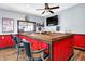 Home bar featuring modern stools, wood countertop, and a ceiling fan at 186 W 600 N, Alexandria, IN 46001