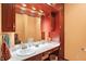Bathroom with dark wood cabinets, white countertop, sink and recessed lighting at 186 W 600 N, Alexandria, IN 46001