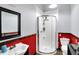 Cozy bathroom featuring a stand up shower, a classic sink, and a toilet with a small decor shelf at 186 W 600 N, Alexandria, IN 46001