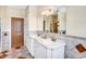 Neutral bathroom featuring a double sink vanity, a large mirror, and neutral tiling at 186 W 600 N, Alexandria, IN 46001