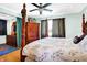 Bedroom with four-poster bed, hardwood floors, and decoratively draped curtains at 186 W 600 N, Alexandria, IN 46001