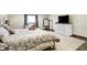 Bright bedroom featuring wood floors, a plush area rug, dresser, and large mirror at 186 W 600 N, Alexandria, IN 46001