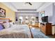 Spacious bedroom featuring a sitting area with large windows and a decorative tray ceiling at 186 W 600 N, Alexandria, IN 46001