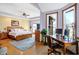 Open concept bedroom featuring an office area, neutral walls, and hardwood floors at 186 W 600 N, Alexandria, IN 46001