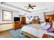 Bedroom with decorative tray ceiling, hardwood floors, large bed and wooden furniture at 186 W 600 N, Alexandria, IN 46001