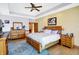 Bedroom with decorative tray ceiling, hardwood floors, large bed and wooden furniture at 186 W 600 N, Alexandria, IN 46001