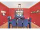 Elegant dining room with modern chandelier, hardwood floors, and stylish decor at 186 W 600 N, Alexandria, IN 46001