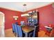 Elegant dining room with modern chandelier, hardwood floors, and stylish decor at 186 W 600 N, Alexandria, IN 46001