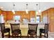 Kitchen featuring an island with bar stool seating, wooden cabinets, and recessed lighting at 186 W 600 N, Alexandria, IN 46001