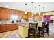 Kitchen showcasing a breakfast bar, oak cabinetry, and stylish pendant lighting at 186 W 600 N, Alexandria, IN 46001