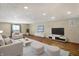 Bright living room featuring neutral furniture, a large window, and sleek entertainment centers at 186 W 600 N, Alexandria, IN 46001