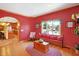 Comfortable sitting room with hardwood floors and a view into the kitchen at 186 W 600 N, Alexandria, IN 46001