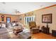 Cozy living room with a large sectional sofa, bay window, and natural lighting at 186 W 600 N, Alexandria, IN 46001