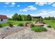 Outdoor kitchen area with a brick patio and extensive landscaping at 186 W 600 N, Alexandria, IN 46001