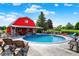 This backyard features a pool with a deck, with a barn-like building in the background at 186 W 600 N, Alexandria, IN 46001
