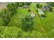 Wide aerial shot of the property highlighting a large, well-maintained yard with outbuildings at 2090 W County Road 400 S, Clayton, IN 46118