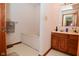 Bathroom with a soaking tub and vanity with wood cabinets at 2090 W County Road 400 S, Clayton, IN 46118