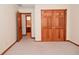 Bedroom featuring closet with wood bi-fold doors and bathroom entrance at 2090 W County Road 400 S, Clayton, IN 46118