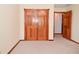 Bedroom closet with wood bi-fold doors at 2090 W County Road 400 S, Clayton, IN 46118