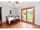 Dining room features a table set for six and sliding glass doors leading to the yard at 2090 W County Road 400 S, Clayton, IN 46118