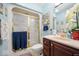 Bathroom featuring an enclosed shower, vanity with a dark wood finish and bright lighting at 3000 E County Road 400 N, Muncie, IN 47303