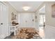 Welcoming foyer with a decorative rug, a seating nook, and natural light at 3000 E County Road 400 N, Muncie, IN 47303