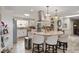 Bright kitchen with an island, counter seating, granite countertops, and stainless appliances at 3000 E County Road 400 N, Muncie, IN 47303