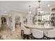 Bright kitchen with an island, counter seating, granite countertops, and stainless appliances at 3000 E County Road 400 N, Muncie, IN 47303